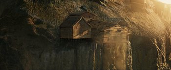 Movie still from “Pathaan” (2023), directed by Siddharth Anand – An old house sitting on top of a cliff; Extreme Wide shot, High angle