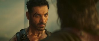 Movie still from “Pathaan” (2023), directed by Siddharth Anand – A person looking into a mirror; Close Up shot, Over the shoulder angle