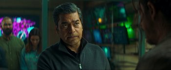 Movie still from “Pathaan” (2023), directed by Siddharth Anand – A person wearing a black shirt; Close Up shot, Over the shoulder angle