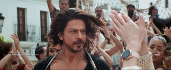 Movie still from “Pathaan” (2023), directed by Siddharth Anand – A person with long hair; Close Up shot, Over the shoulder angle