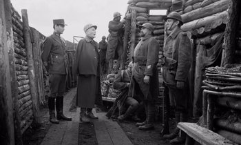 Movie still from “Paths of Glory” (1957), directed by Stanley Kubrick – A group of men standing next to each other on a dock; Medium shot, Over the shoulder angle