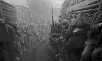 Movie still from “Paths of Glory” (1957), directed by Stanley Kubrick – A black and white photo of a group of soldiers; Wide shot, Low angle