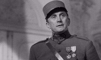 Movie still from “Paths of Glory” (1957), directed by Stanley Kubrick – An old photo of a man in a military uniform; Close Up shot, Low angle