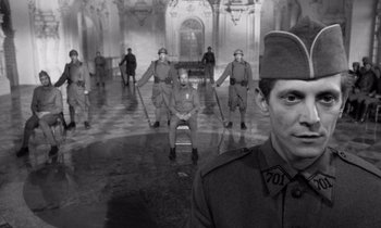 Movie still from “Paths of Glory” (1957), directed by Stanley Kubrick – A group of men dressed in uniform in a room; Medium shot, High angle