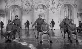 Movie still from “Paths of Glory” (1957), directed by Stanley Kubrick – Black and white photograph of men in uniform in an ornate room; Wide shot, Low angle