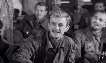 Movie still from “Paths of Glory” (1957), directed by Stanley Kubrick – Black and white photograph of a man in military garb; Close Up shot, Over the shoulder angle