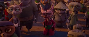 Movie still from “Paws of Fury: The Legend of Hank” (2022), directed by Chris Bailey – A group of people that are standing in the street; Medium shot, Over the shoulder angle