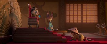 Movie still from “Paws of Fury: The Legend of Hank” (2022), directed by Chris Bailey – A group of cats sitting on top of a wooden table; Wide shot, Low angle