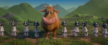 Movie still from “Paws of Fury: The Legend of Hank” (2022), directed by Chris Bailey – A cow standing in the middle of a group of cats in a field; Wide shot, Low angle