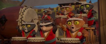 Movie still from “Paws of Fury: The Legend of Hank” (2022), directed by Chris Bailey – A group of cats dressed up as a drummer; Close Up shot, Low angle