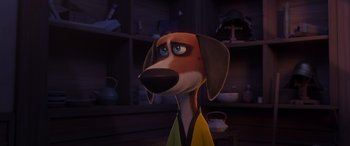 Movie still from “Paws of Fury: The Legend of Hank” (2022), directed by Chris Bailey – A cartoon dog wearing a yellow robe in a dark room; Close Up shot, High angle