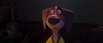 Movie still from “Paws of Fury: The Legend of Hank” (2022), directed by Chris Bailey – A cartoon dog with a yellow shirt and a brown collar; Close Up shot, Low angle