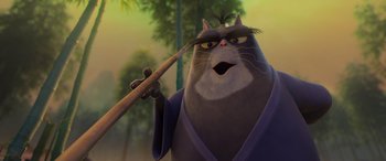Movie still from “Paws of Fury: The Legend of Hank” (2022), directed by Chris Bailey – A cat is holding a pair of chopsticks in his mouth; Close Up shot, Low angle