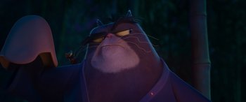 Movie still from “Paws of Fury: The Legend of Hank” (2022), directed by Chris Bailey – A cat's face in the dark; Close Up shot, Low angle