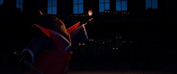 Movie still from “Paws of Fury: The Legend of Hank” (2022), directed by Chris Bailey – A group of people standing in front of a building; Extreme Wide shot, Low angle