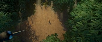 Movie still from “Paws of Fury: The Legend of Hank” (2022), directed by Chris Bailey – An aerial view of a person walking on a dirt path; Extreme Wide shot, Overhead angle