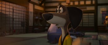 Movie still from “Paws of Fury: The Legend of Hank” (2022), directed by Chris Bailey – A cartoon dog with a yellow shirt and a black and white shirt; Close Up shot, High angle
