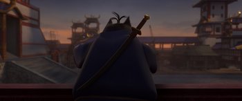 Movie still from “Paws of Fury: The Legend of Hank” (2022), directed by Chris Bailey – The back view of a cartoon character with a sword; Medium shot, Low angle