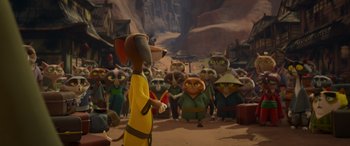 Movie still from “Paws of Fury: The Legend of Hank” (2022), directed by Chris Bailey – A crowd of people gathered together; Wide shot, Over the shoulder angle