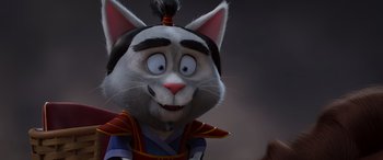 Movie still from “Paws of Fury: The Legend of Hank” (2022), directed by Chris Bailey – A cat character with a wig and a wig on it's head; Close Up shot, High angle