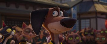 Movie still from “Paws of Fury: The Legend of Hank” (2022), directed by Chris Bailey – A cartoon dog with blue eyes and a yellow shirt; Close Up shot, Low angle