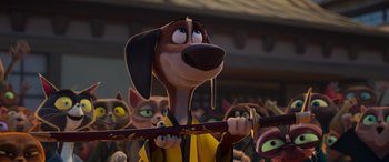 Movie still from “Paws of Fury: The Legend of Hank” (2022), directed by Chris Bailey – A dog holding a cane in front of a group of cats; Close Up shot, Low angle