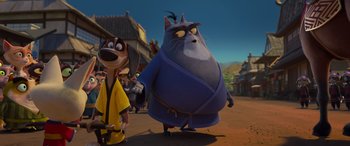 Movie still from “Paws of Fury: The Legend of Hank” (2022), directed by Chris Bailey – A cat and a dog are standing in the middle of the street; Wide shot, Low angle