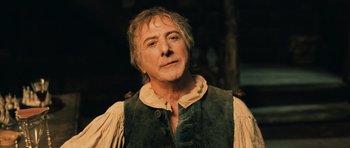 Movie still from “Perfume: The Story of a Murderer” (2006), directed by Tom Tykwer – A person wearing a vest; Close Up shot, Low angle