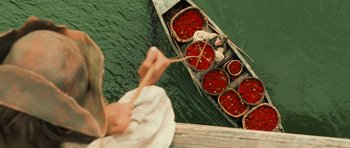 Movie still from “Perfume: The Story of a Murderer” (2006), directed by Tom Tykwer – A boat filled with lots of baskets filled with food; Wide shot, Overhead angle