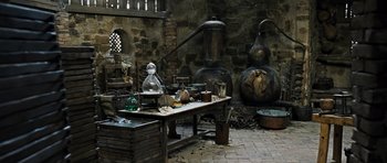 Movie still from “Perfume: The Story of a Murderer” (2006), directed by Tom Tykwer – A table with a lot of stuff on top of it; Wide shot, High angle