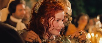Movie still from “Perfume: The Story of a Murderer” (2006), directed by Tom Tykwer – A person with long red hair; Close Up shot, Over the shoulder angle