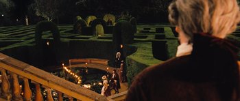 Movie still from “Perfume: The Story of a Murderer” (2006), directed by Tom Tykwer – A group of people standing around a garden; Extreme Wide shot, High angle