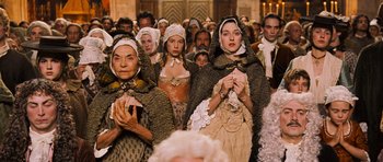 Movie still from “Perfume: The Story of a Murderer” (2006), directed by Tom Tykwer – A group of people dressed in period clothing; Medium shot, High angle