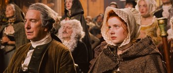 Movie still from “Perfume: The Story of a Murderer” (2006), directed by Tom Tykwer – A group of people dressed in period clothing; Close Up shot, Over the shoulder angle