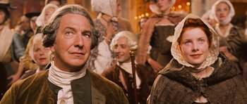 Movie still from “Perfume: The Story of a Murderer” (2006), directed by Tom Tykwer – A group of people dressed in period clothing; Close Up shot, Over the shoulder angle