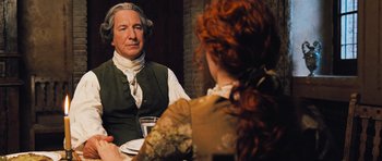 Movie still from “Perfume: The Story of a Murderer” (2006), directed by Tom Tykwer – A man and a woman sitting at a dinner table; Close Up shot, Over the shoulder angle