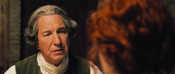 Movie still from “Perfume: The Story of a Murderer” (2006), directed by Tom Tykwer – A wax statue of a man in a suit and a wig; Close Up shot, Over the shoulder angle