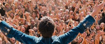 Movie still from “Perfume: The Story of a Murderer” (2006), directed by Tom Tykwer – A large group of people are gathered in a crowd; Wide shot, High angle