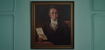 Movie still from “Persuasion” (2022), directed by Carrie Cracknell – A painting of an older man holding a paper; Close Up shot, Low angle