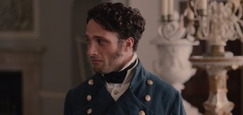 Movie still from “Persuasion” (2022), directed by Carrie Cracknell – A person wearing a jacket; Close Up shot, Over the shoulder angle