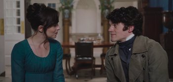 Movie still from “Persuasion” (2022), directed by Carrie Cracknell – A man and a woman talking in front of each other; Close Up shot, Over the shoulder angle