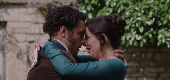 Movie still from “Persuasion” (2022), directed by Carrie Cracknell – A man and a woman embracing each other outside; Close Up shot, Over the shoulder angle