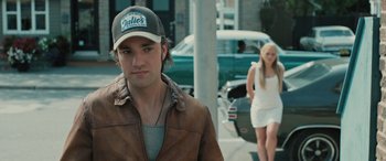 Movie still from “Pet Sematary: Bloodlines” (2023), directed by Lindsey Anderson Beer – A man and a woman walking down a street; Close Up shot, Over the shoulder angle