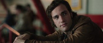 Movie still from “Pet Sematary: Bloodlines” (2023), directed by Lindsey Anderson Beer – A person with long hair; Close Up shot, Over the shoulder angle