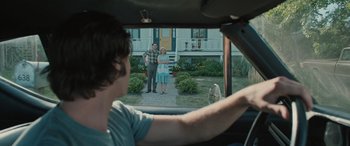 Movie still from “Pet Sematary: Bloodlines” (2023), directed by Lindsey Anderson Beer – A man and a woman standing in front of a house; Medium shot, Over the shoulder angle