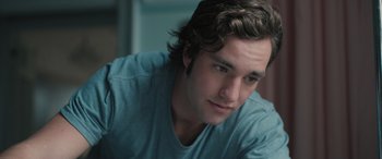 Movie still from “Pet Sematary: Bloodlines” (2023), directed by Lindsey Anderson Beer – A person wearing a blue shirt; Close Up shot, Over the shoulder angle