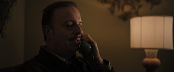 Movie still from “Pet Sematary: Bloodlines” (2023), directed by Lindsey Anderson Beer – A person talking on a phone; Close Up shot, Low angle