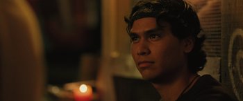 Movie still from “Pet Sematary: Bloodlines” (2023), directed by Lindsey Anderson Beer – A person looking at the camera; Close Up shot, Over the shoulder angle