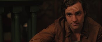 Movie still from “Pet Sematary: Bloodlines” (2023), directed by Lindsey Anderson Beer – A person wearing a brown jacket; Close Up shot, Over the shoulder angle