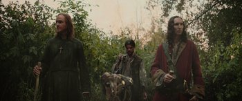 Movie still from “Pet Sematary: Bloodlines” (2023), directed by Lindsey Anderson Beer – A group of people standing in the woods; Medium shot, Low angle